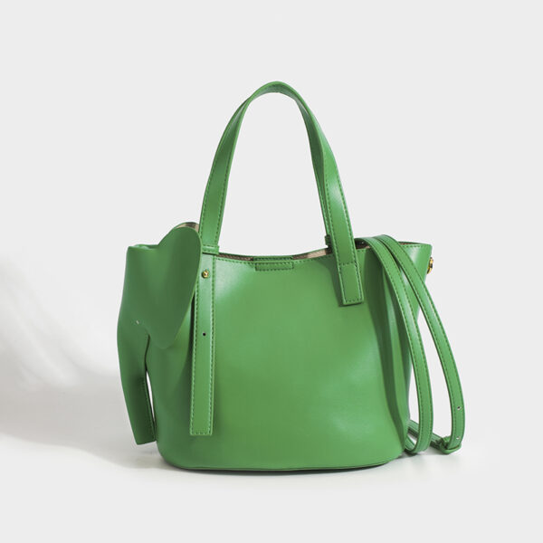 green handheld cabas handbag